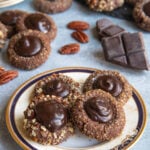 Chocolate Thumbprint Cookies on a plate with cookies in the background
