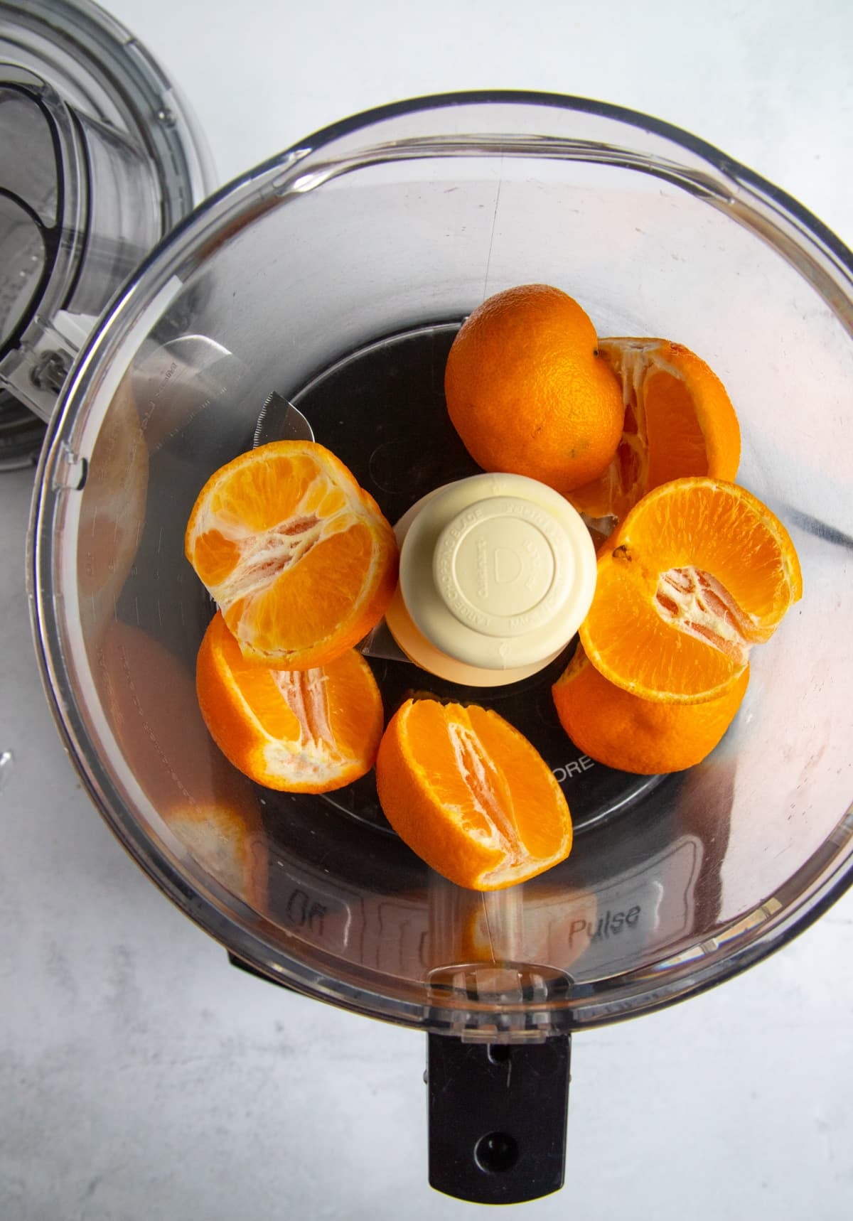 Clementine Oranges iin the bowl of a food processor