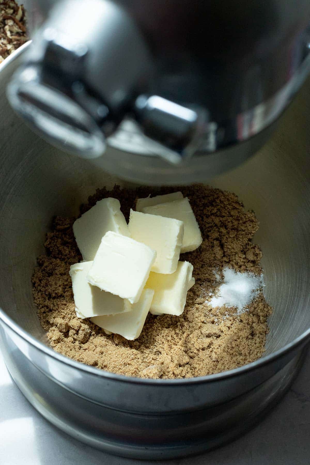 Dark brown sugar, salted butter, and kosher salt in the large bowl of a stand mixer