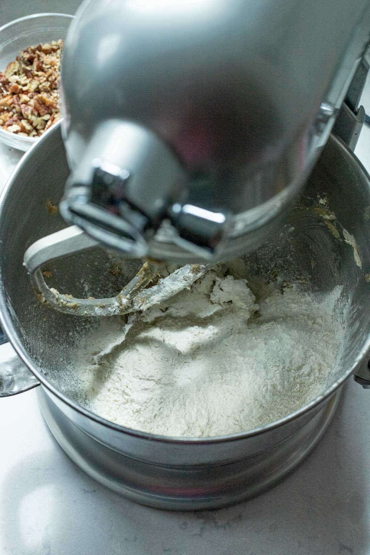 The all-purpose flour added to the sugar-butter mixture in the bowl of a stand mixer