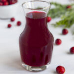 Cranberry simple syrup in a glass jar