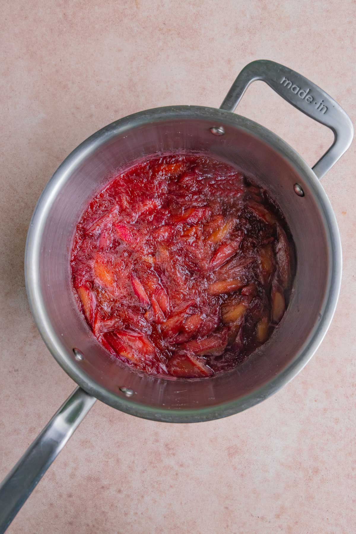 Cooked rhubarb in a stainless steel saucepan