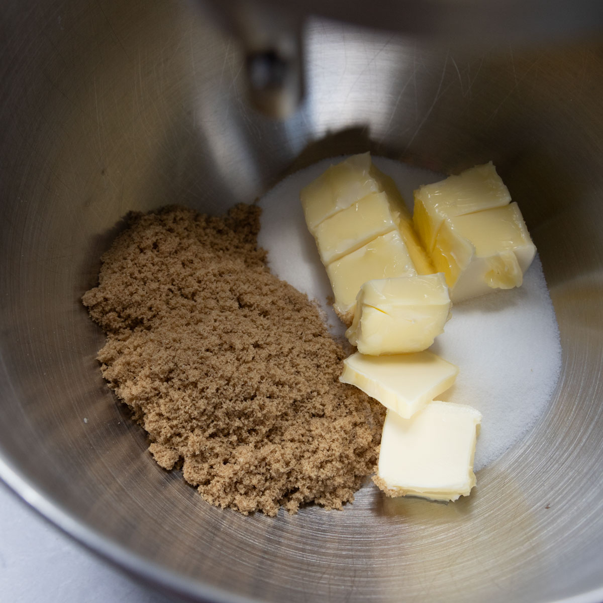 Butter, granulated sugar, and brown sugar in the bowl of a stand mixer