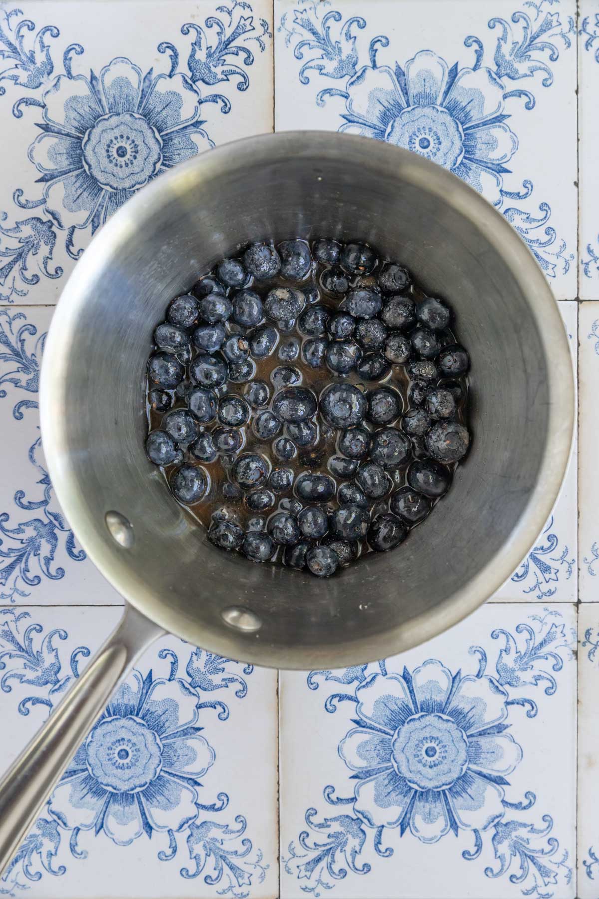 Blueberries. cinnamon, sugar, lemon juice, and water in a stainless steel saucepan