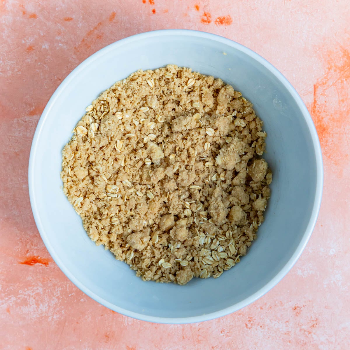 Brown sugar crumble with oats in a ceramic bowl