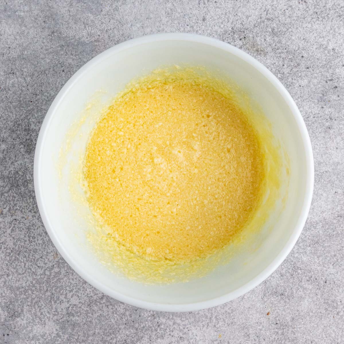 Eggs beaten with sugar and butter.  The mixture appears curdled.