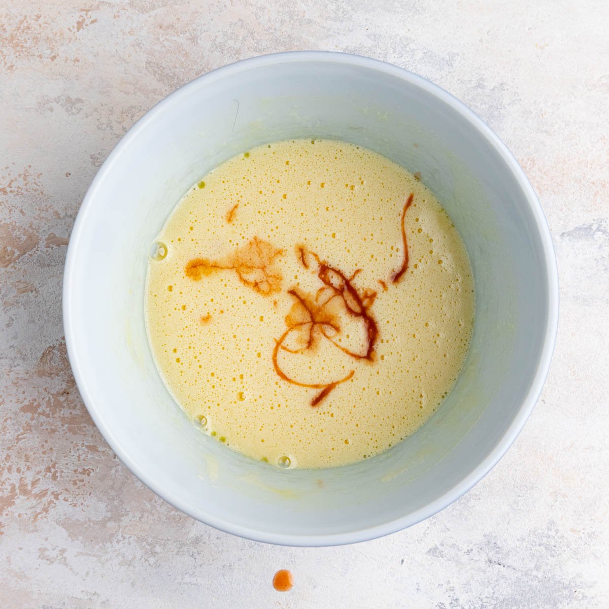 Cooked peach syrup added to the muffin batter. The syrup is dark brown