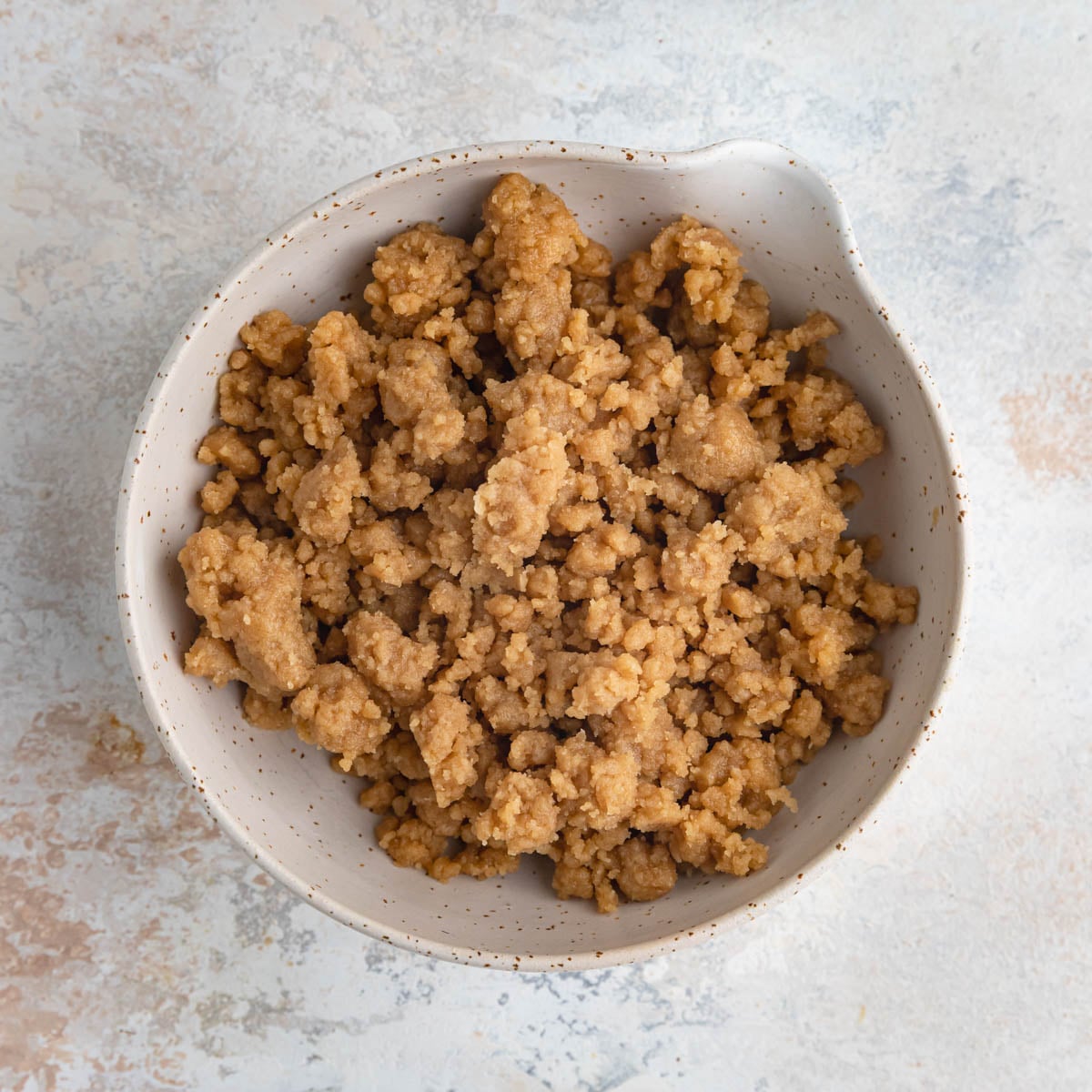 Brown sugar crumble in a small ceramic bowl