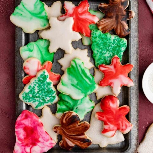Decorated shortbread cookies on a grey metal platter