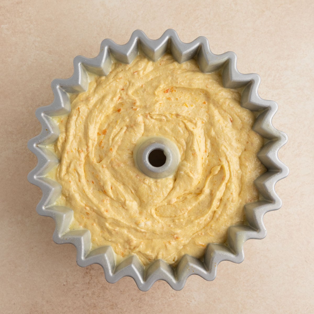 A 10-cup Nordicware Bundt pan filled with the Clementine cake batter