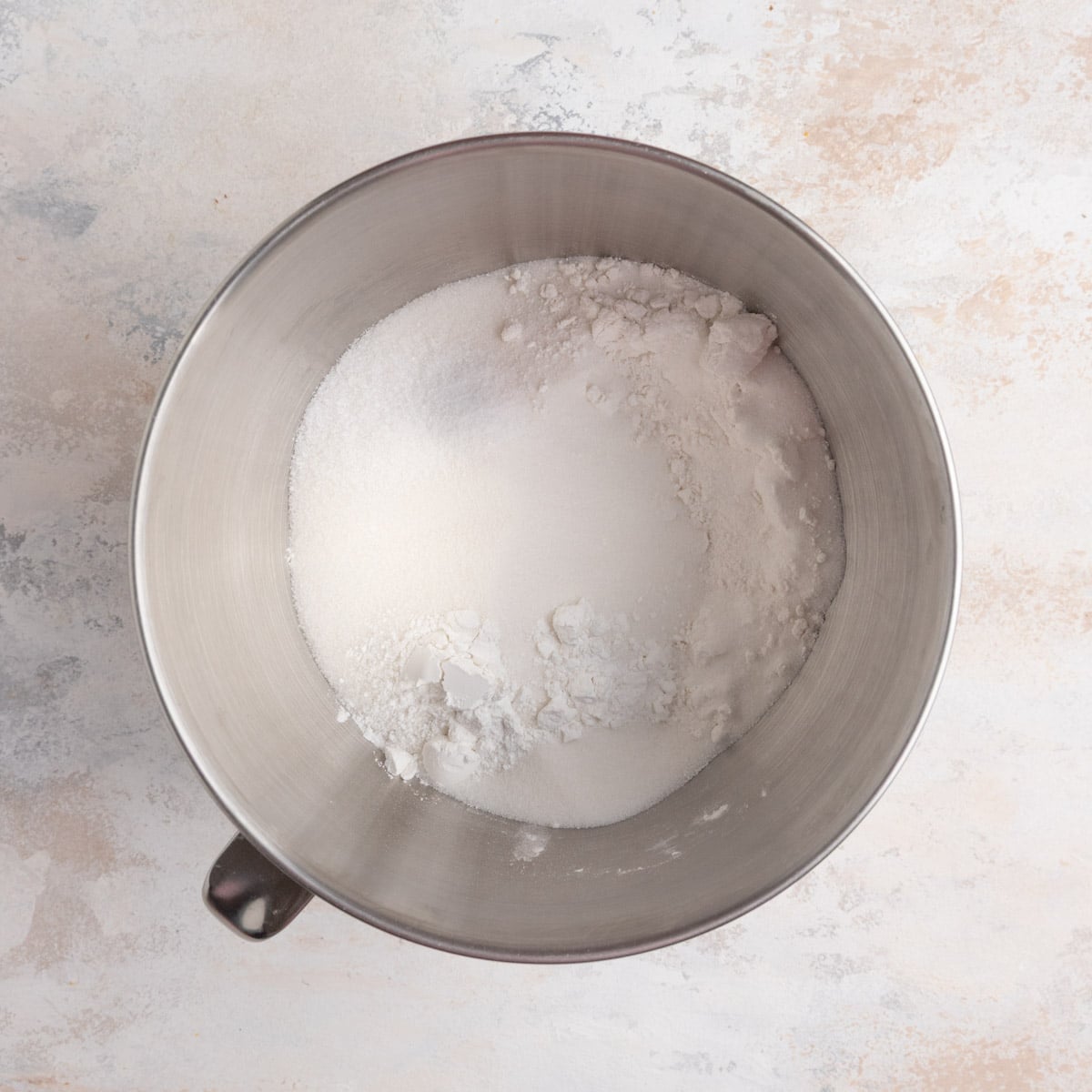 Cake flour, sugar, baking powder, and kosher salt in the bowl of a stand mixer