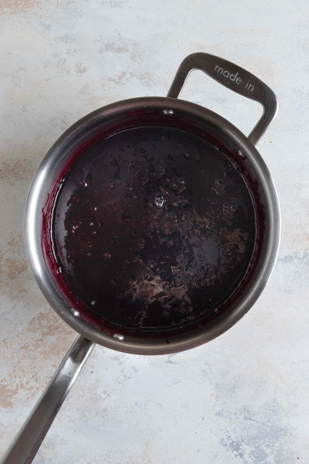 Blackberry jam in a stainless steel pot